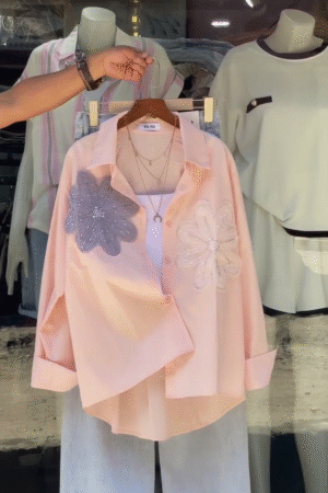 Chic Women’s Casual Outfit 🌸 | Elegant Peach Button-Down Shirt with Beaded Floral Embroidery ✨ & Relaxed-Fit Light Blue Jeans 👖 – Stylish Everyday Wear with Layered Necklace Accessory"