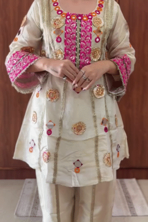 Traditional Ivory Silk Straight Kurta Set with Pink-Gold Mirror Embroidery, Gota Work, and Festive Mirror Appliqué Accents Paired with Coordinated Palazzo Pants