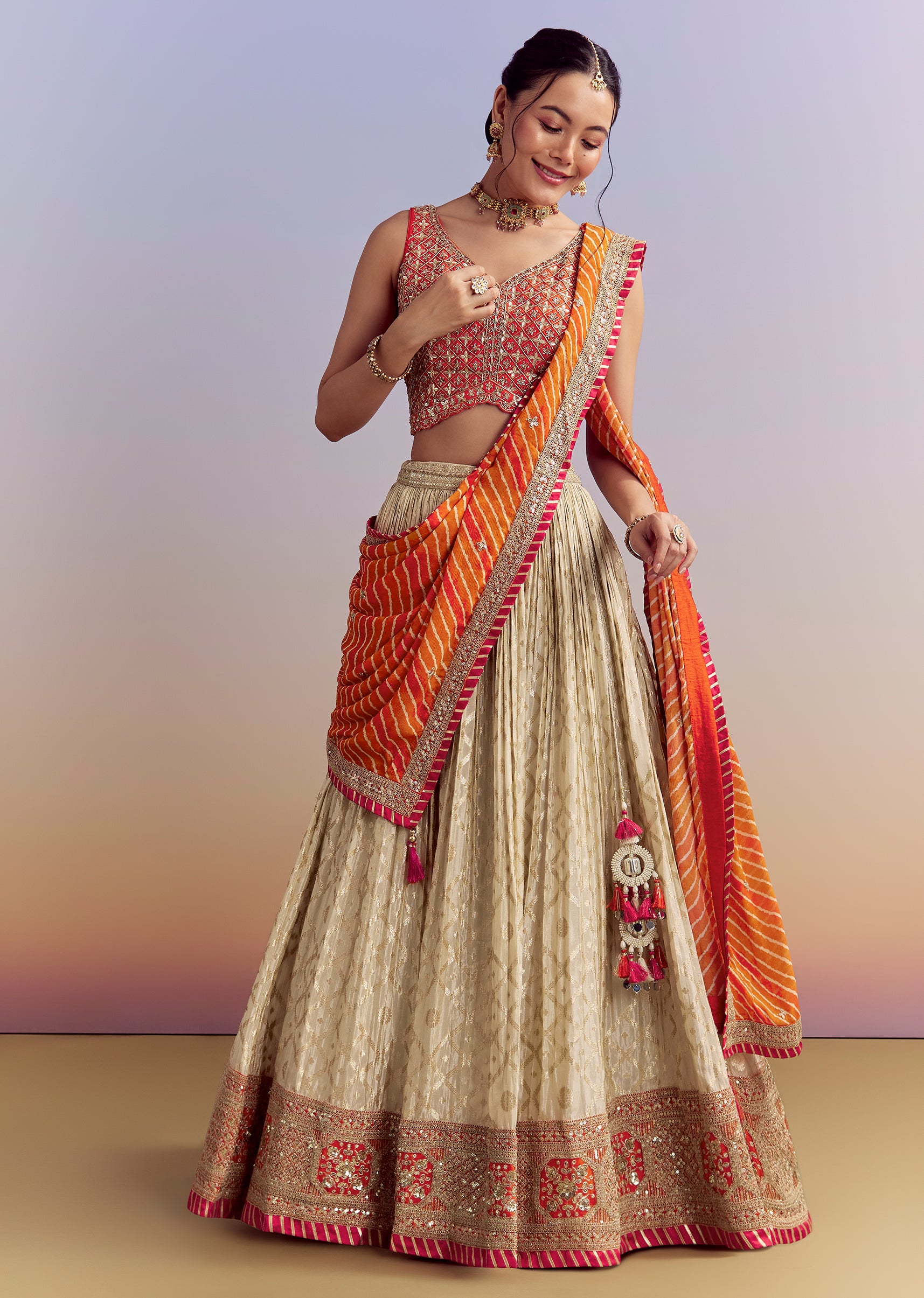 Beige Brocade Lehenga with Orange Leheriya Dupatta