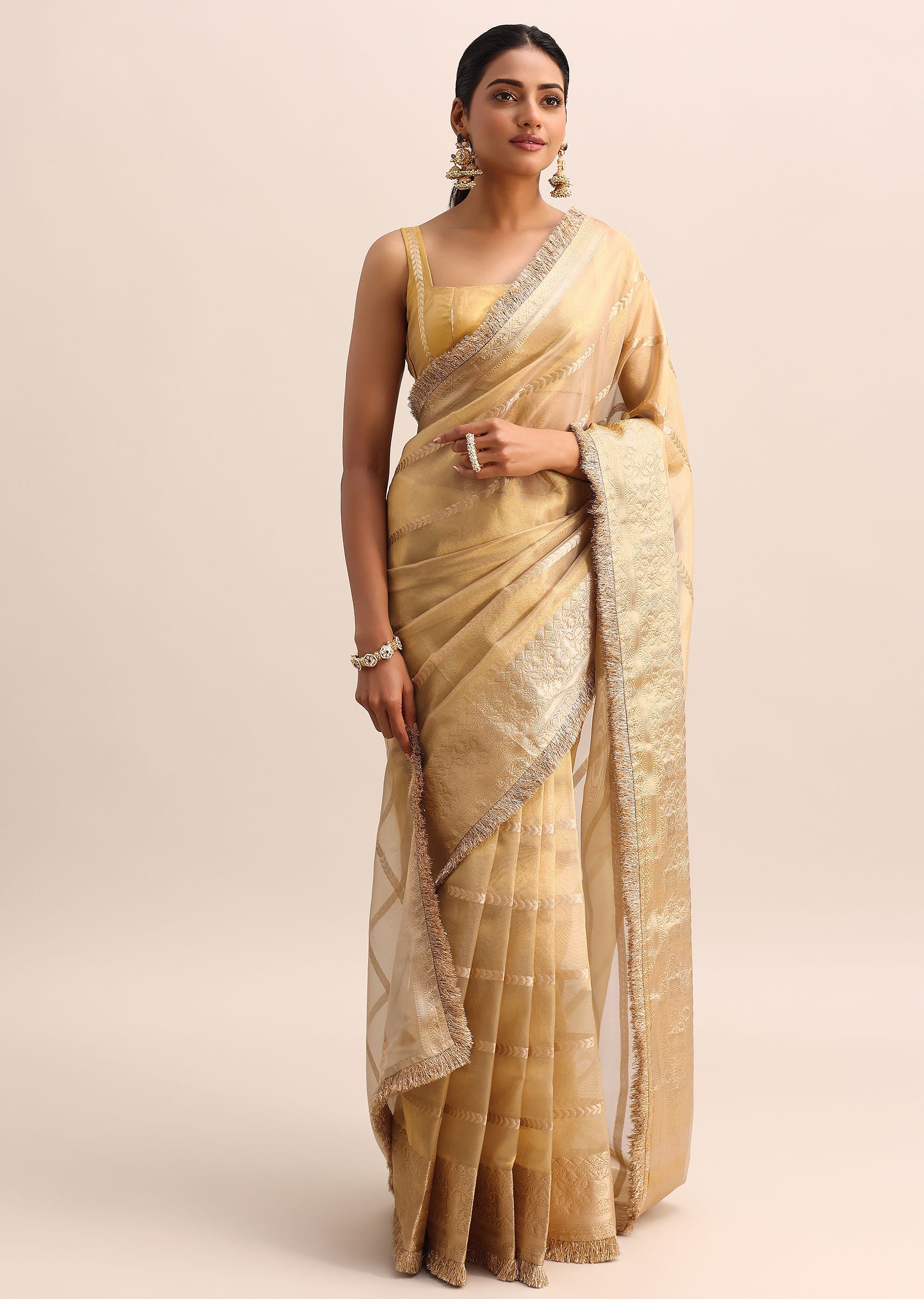 Champagne Gold Silk Saree with Zari Woven Border and Frill Detailing ✨🥂