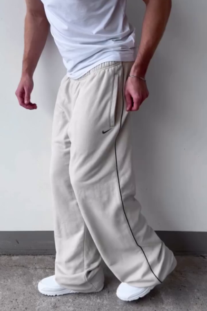 Off‑White Relaxed Wide‑Leg Track Pants with Elastic Waist and Black Side Piping for Athleisure & Lounge Wear” 🤍