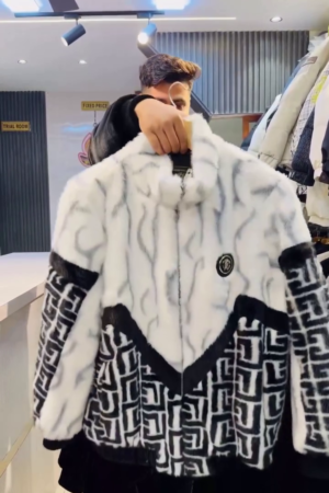 Black & White Faux‑Fur Zip‑Up Winter Jacket with Geometric Panel Detailing and Badge Accent for Men” 🖤🤍